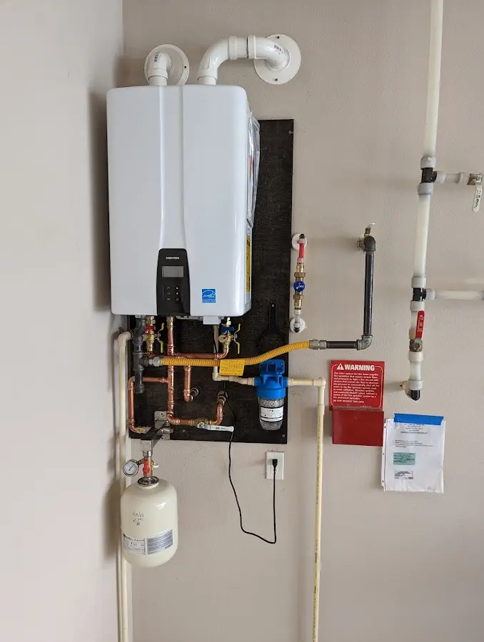 Professional plumber installing copper piping in a Washougal home